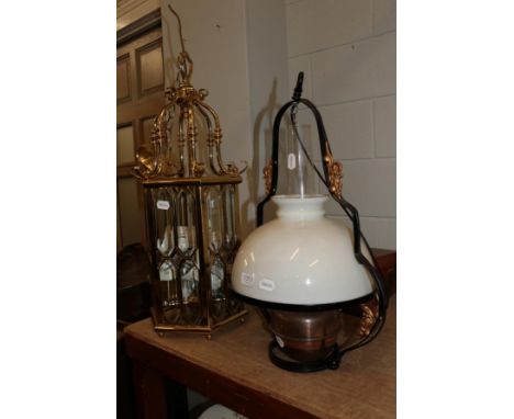 A reproduction brass hanging hexagonal shaped lantern, 70cm high (excluding chain); together with an oil lamp and shade 