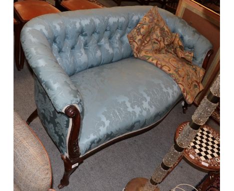 A Victorian mahogany two-seater sofa, upholstered in blue buttoned fabric 