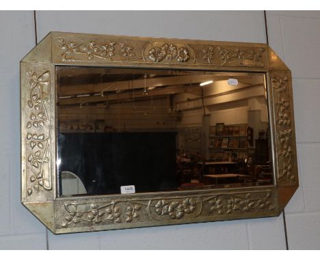 A brass Arts &amp; Crafts style bevel mirror; together with an English school (19th/20th century) portrait of a lady seated r