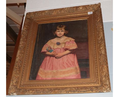 British School (19th/20th century) Portrait of a young girl, three quarter length, wearing a pink dress and holding a a doll,