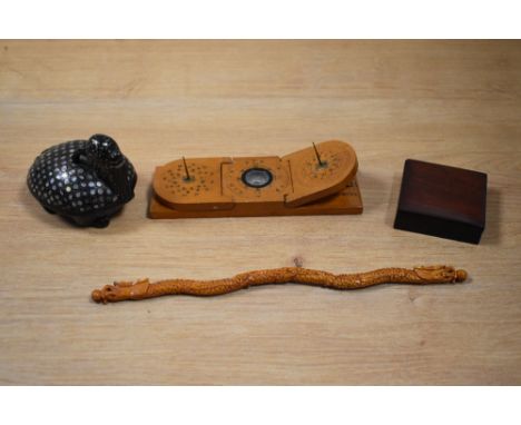 A Chinese mother of pearl inlaid lidded trinket box, in the form of a goat, a small Chinese pocket compass and sundial, a Chi