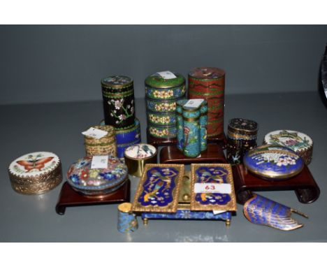 An assorted collection of Chinese Cloisonne enamelled ware, to include spice towers, and trinket dishes, against blue, black,