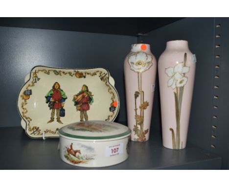 A pair of early 20th Century Royal Doulton vases, decorated with white daffodils against a pink ground, having manufacturer's