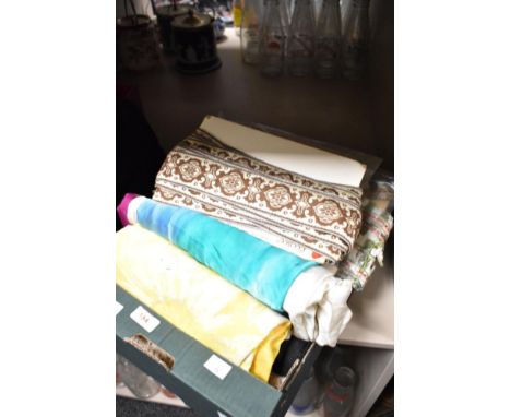 A selection of fabrics, including silk and vintage braiding and edging tapes.