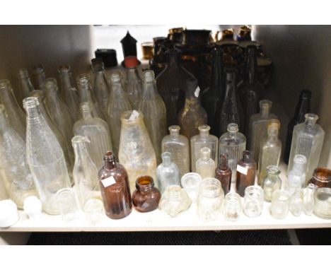 A large collection of vintage bottles, including advertising bottles of interest to Carlisle and another for Silloth,Wigton a