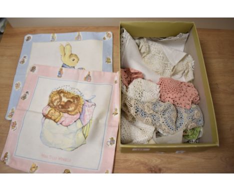 A selection of vintage doyleys and two Beatrix potter cushion covers.