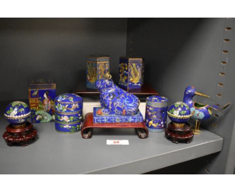 An assorted collection of Chinese cloisonne enamelled ware, to include ox, spherical trinket boxes, spice tower, and other it