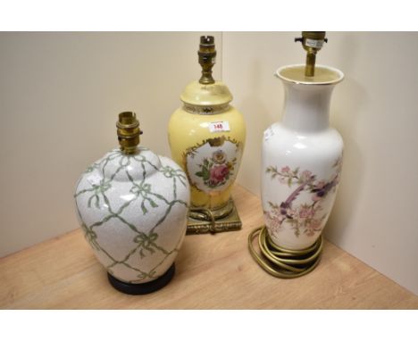 Three lamp bases, comprising yellow ceramic lamp with floral decoration, vintage crackle glazed ginger jar formed lamp with b