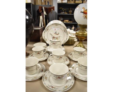 A Royal Doulton 'Kingswood' set of cups and saucers, cake plate, side plates, jug and sugar basin, having delicate floral pat