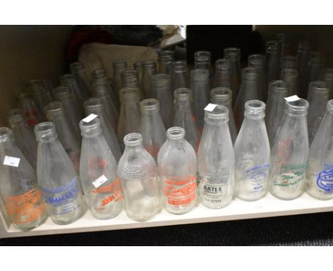 A large collection of vintage advertising milk bottles, of interest to Southport, Blackburn, Horwich etc.