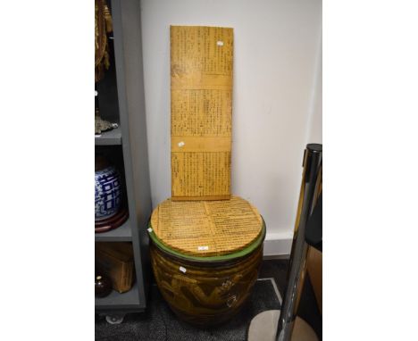 An early 20th Century Chinese brown glaze egg pot planter, decorated with dragon motifs, and two decorative Chinese calligrap