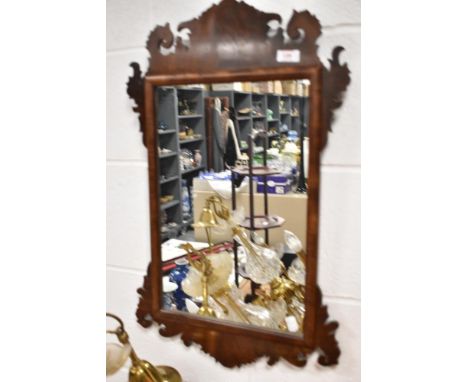 A 19th//early 20th century scroll fret framed Chippendale style wall mirror.