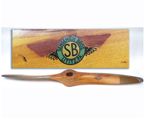 A VINTAGE SENSENICH MAHOGANY TWO BLADE LARGE PROPELLER WITH ALLOY MOUNTED TIPS AND RIMS, EACH BLADE APPLIED WITH A PAPER LABE