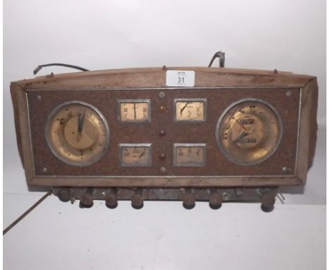 A VINTAGE CAR DASHBOARD PANEL COMPLETE WITH JAEGER CLOCK, SPEEDOMETER, WATER TEMPERATURE GAUGE, AMP METER, FUEL GAUGE AND OIL