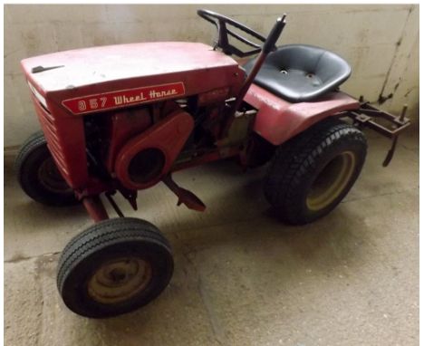 857 WHEEL HORSE GARDEN TRACTOR WITH IMPLEMENT