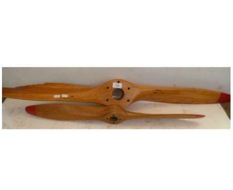 A PAIR OF VINTAGE WOODEN PROPELLERS, ONE LABELLED US PROPELLERS INC WITH SOME DAMAGE AND A SMALLER PROPELLER 