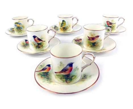 A set of six Royal Worcester porcelain demi tasse coffee cans and saucers, each painted with birds birds, by E Townsend, with