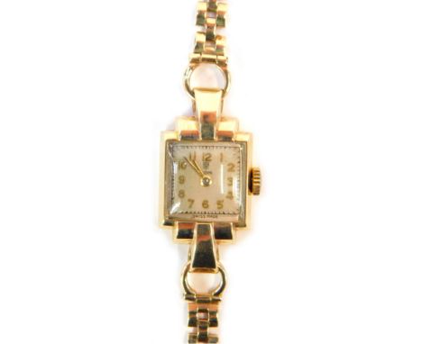 A 9ct gold Tudor lady's wristwatch, with a rectangular silver coloured numeric watch head, 1.2cm x 1.2cm, on a three bar brac