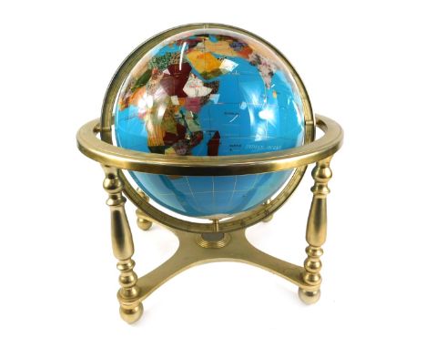 A mid 20thC tabletop terrestial globe, with hardstone inlay, in a brass gimbal frame, 40cm high, 36cm wide, 31cm deep.  Note: