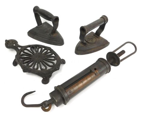 A Slater and Company hanging scale, together with a J&amp;J Siddons of West Bromwich number 8 cast flat iron, 5/700K flat iro
