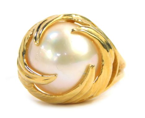 A cultured pearl dress ring, with a greyish lustre pearl, in swirl setting with V splayed shoulders, yellow metal stamped 10k