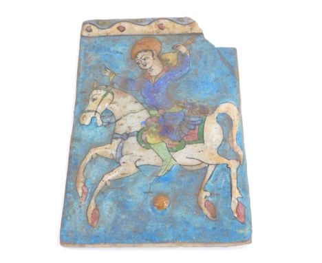 A 19thC Persian tile depicting a horseman, 22cm x 16cm. (AF) 