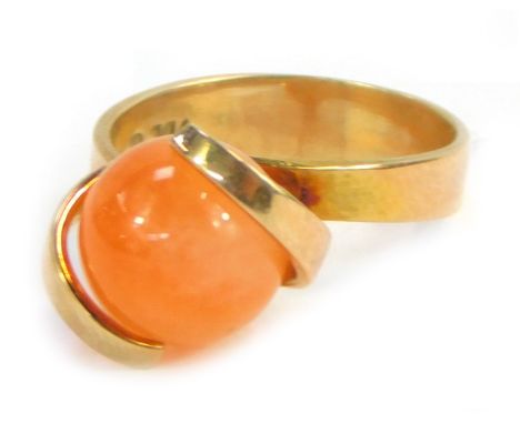 A 9ct gold dress ring, set with swivel orange agate in two claw tension setting, size M, 4.8g all in.