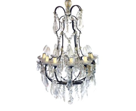 A cast iron framed twelve branch chandelier, with brilliant and tear drop shaped drops, 75cm high. 