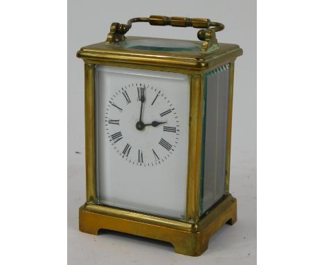 A 19thC French brass cased carriage timepiece, with a white enamel Roman numeric dial, and clockwork single barel movement, t