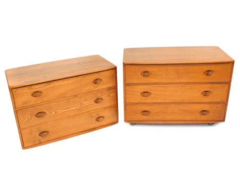 A pair of Ercol light elm chests, with a bow fronted top above three drawers, one lacking feet, 59cm high, 92cm wide, 47cm de