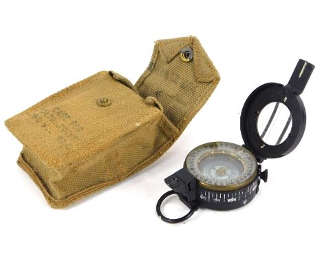 A World War II military compass, Mark III 1942, by TG and Company Limited London, number 3183017, with a canvas pouch. 