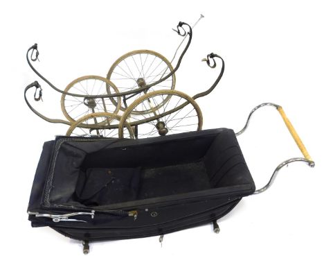 A vintage Fetha-Lite pram, with a carriage suspension, and blue leatherette and fabric interior, 129cm wide. 