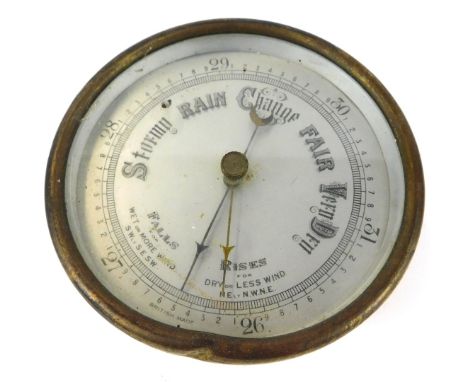 An early 20thC brass cased circular barometer, with silvered dial, 13cm diameter. 