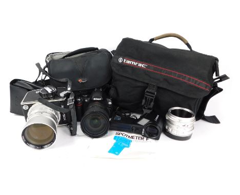 A group of camera and optics equipment, comprising Minolta spot meter F, Nikon D60 camera, with Nikon AF-S Nikor 18-200mm DX 