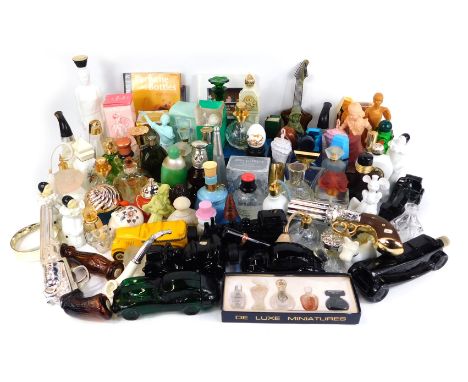 A collection of vintage Avon and other perfume bottles, to include glass cars, opalescent figures, stage cannon, some boxed, 