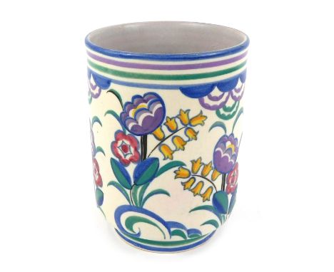 An early 20th Poole, Carter Stabler Adams, pottery vase, of cylindrical form, painted with flowers, impressed marks, 17cm hig