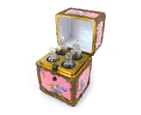A late 18thC enamel scent bottle necessaire, with painted floral decoration against a pink ground, brass bound with rococo sc