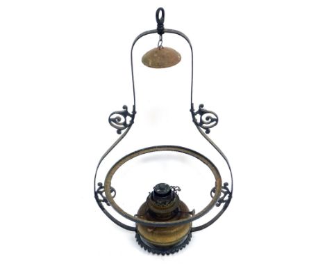 A 19thC cast iron hanging oil lamp, on a shaped and fluted base, with oil lamp fitment, 90cm high. 