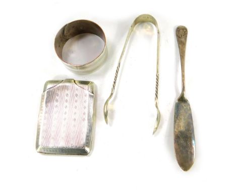 A George V silver match sleeve, with engine turned decoration, Birmingham 1929, a pair of Victorian silver sugar tongs, Birmi