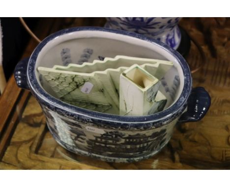 A blue and white lamp two Carn pottery vases and a planter  with fish decoration.