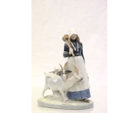 Royal Copenhagen model of a girl holding a mallet with two goats, number 692