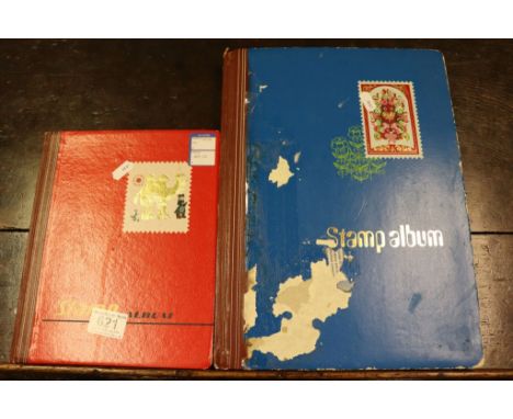 Two albums of vintage stamps.