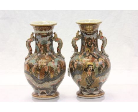 Pair of Japanese ceramic vases with hand painted decoration and dragon handles & character marks to base