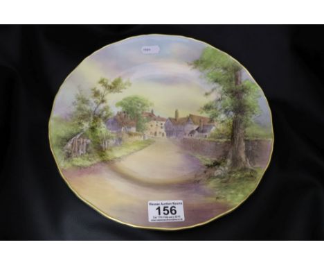 A Royal Worcester large handpainted plate, "Tewkesbury"  signed D WIlson to lower right, impressed mark F310 to reverse, wavy