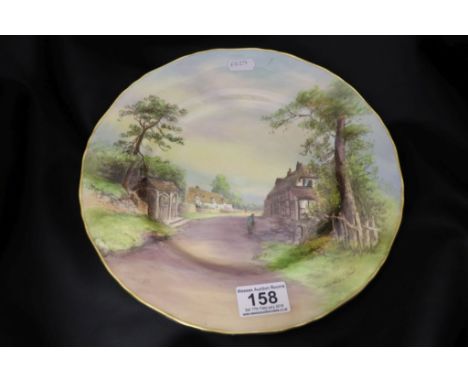 A Royal Worcester hand painted cabinet plate, titled "Weyford on Avon", signed W Nicholls to lower right, date code for 1953,