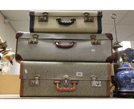 Four vintage suitcases, some with keys