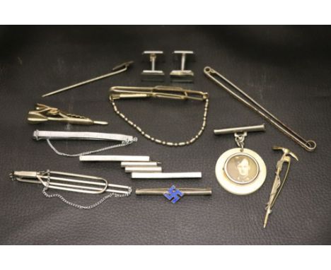 A crucifix stick pin, cufflinks, tie pins etc