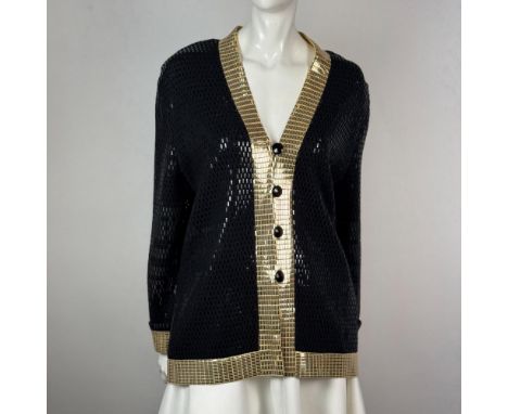 A sophisticated color block pattern button down jacket with black and gold rectangular sequin embellishment and shoulder pads
