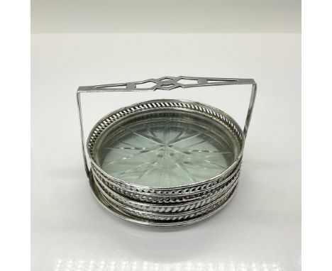 These lovely coasters are made of cut crystal surrounded by a sterling silver decorative fence and housed in a sterling caddy