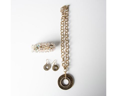 The necklace and earrings feature textured gold tone metal. The necklace measures 21.5"L, but can be adjusted shorter and the